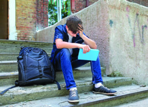 Sad Student With The Book