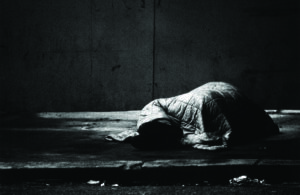 tramp sleeping rough on the street