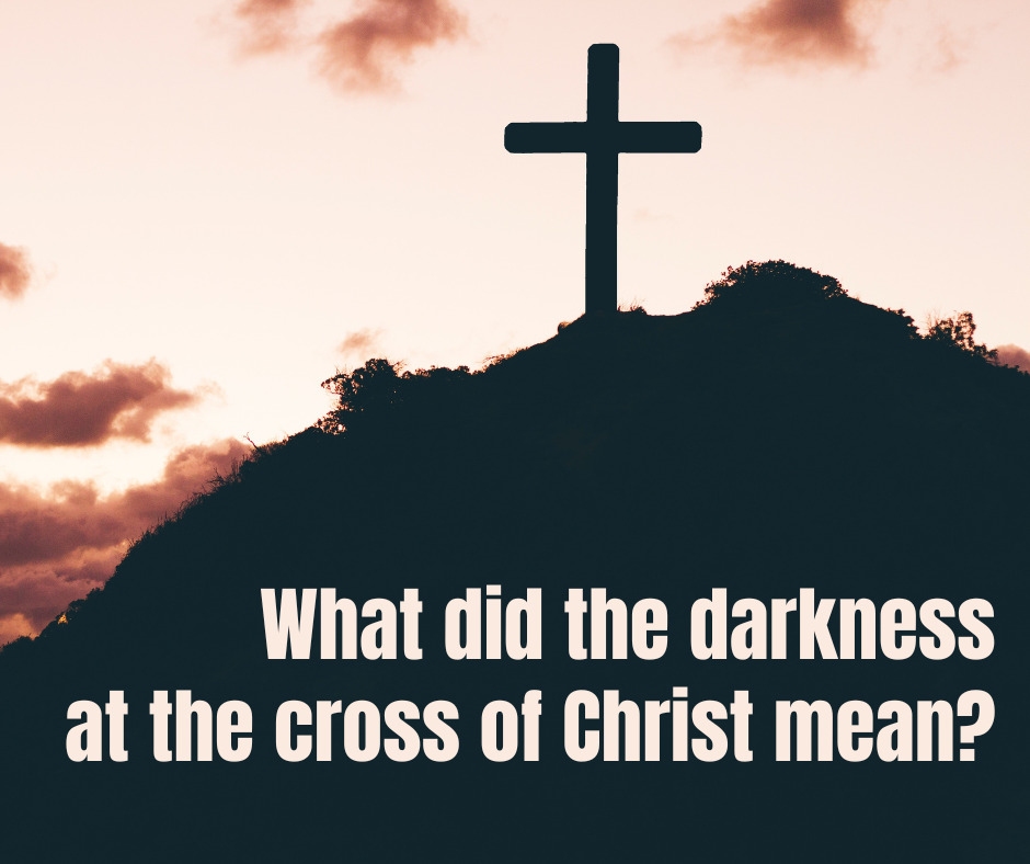 What did the darkness at the cross of Christ mean